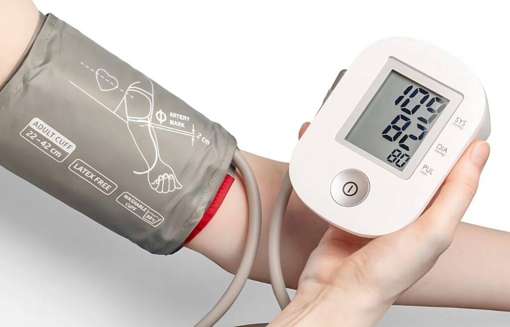 Person checking their blood pressure undrestands that being overweight affects health.