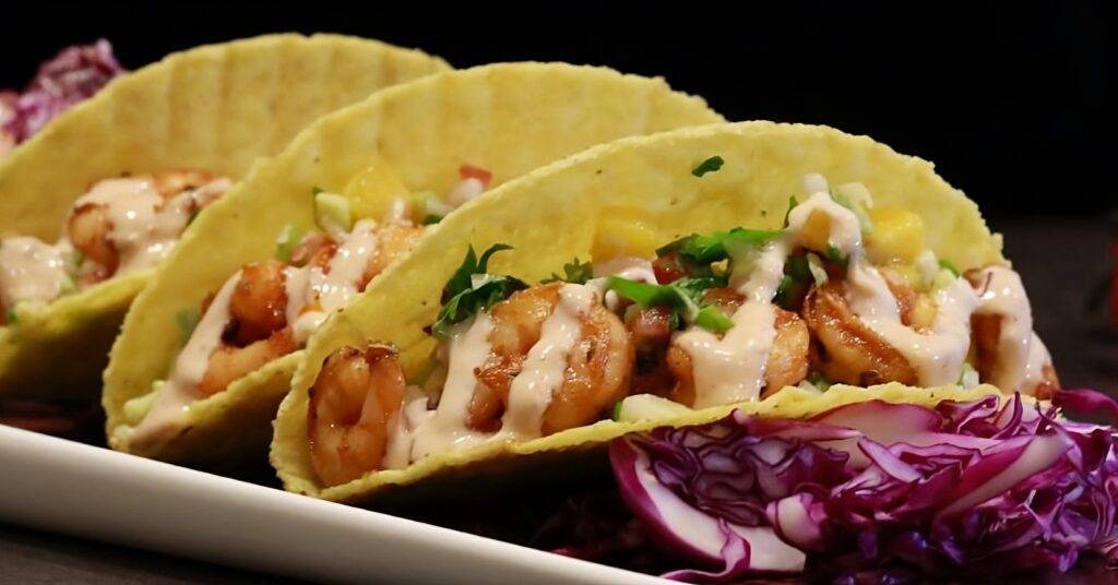 Shrimp tacos with a creamy avocado sauce.