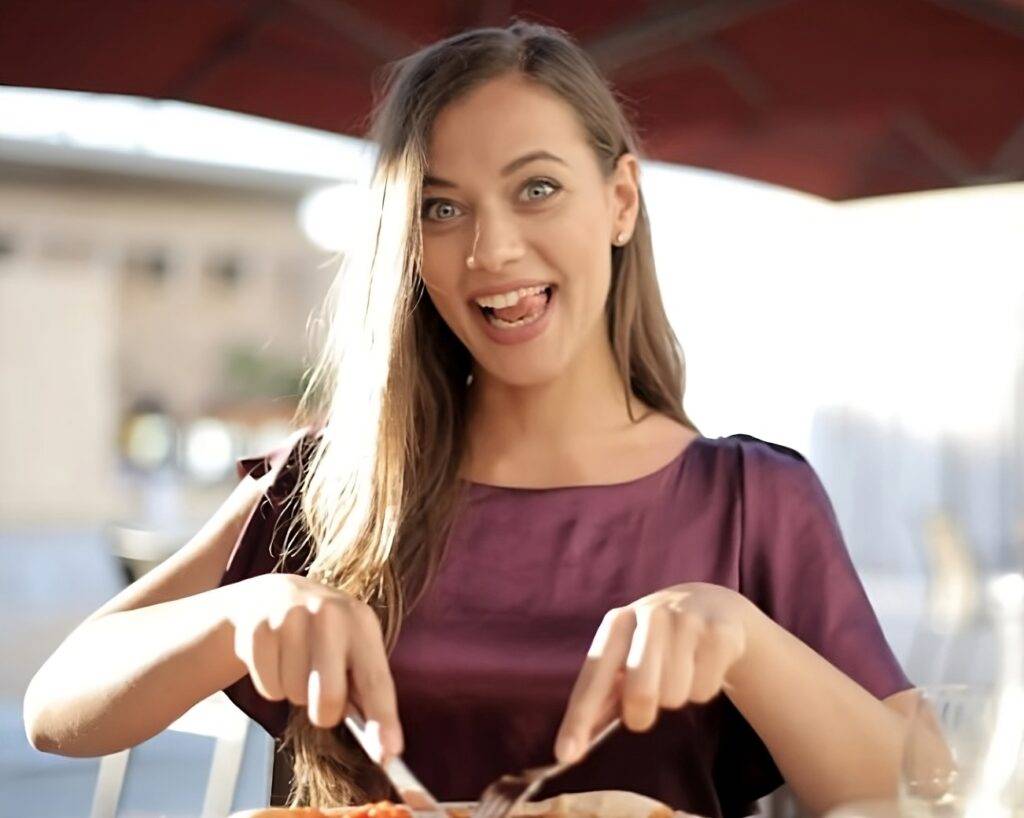 Woman eating avocado toast.