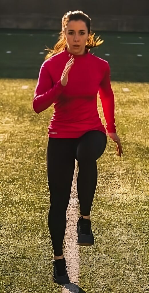 Woman running to raise metabolic rate.