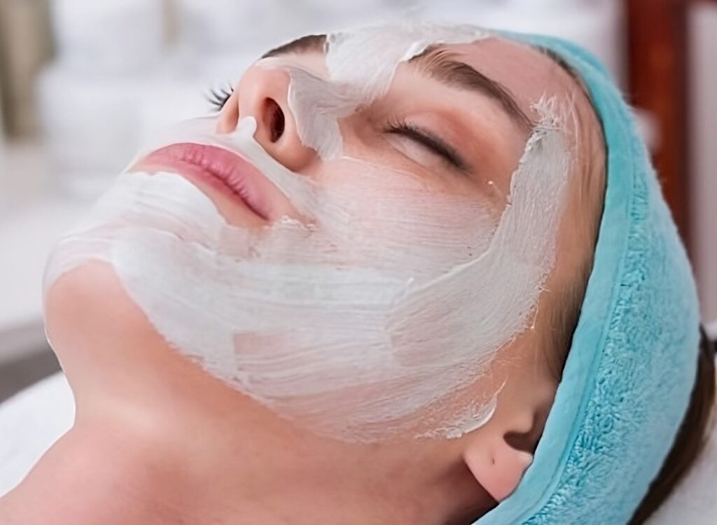 Woman wearing face cream for smoother skin.
