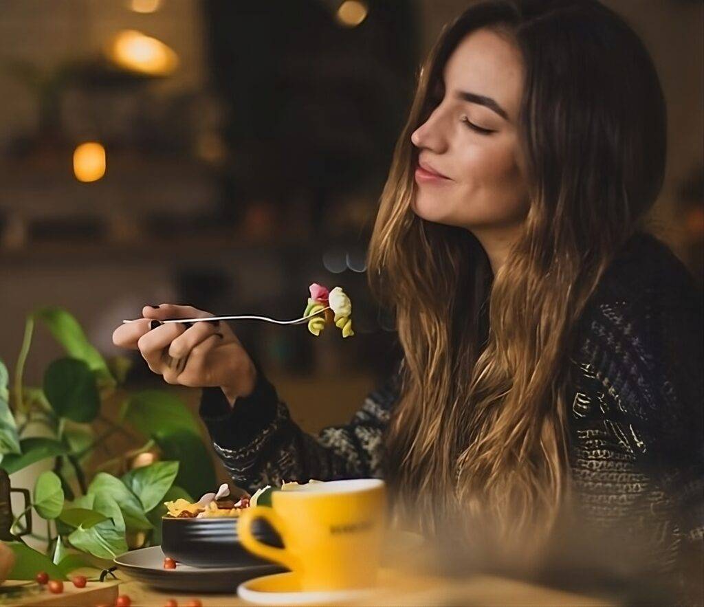 Woman eating for a body cleansing meal plan.