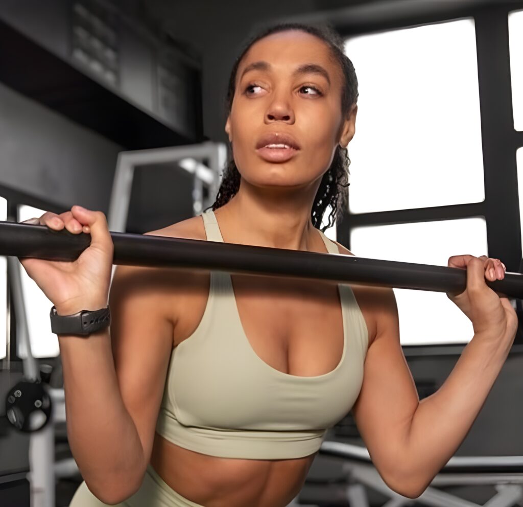 Woman weight training to burn arm fat
